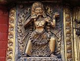 Kathmandu Bhaktapur 04-4 Bhaktapur Durbar Square Golden Gate Emaciated Deity Close Up An emaciated tantric deity flanks the door of the Golden Gate in Bhaktapur�s Durbar Square.